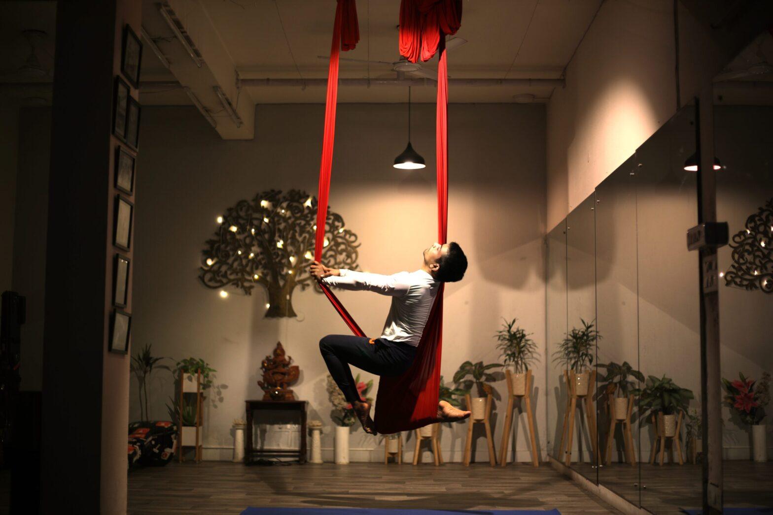 aERIAL yOGA pOSE ON hAMMOCK