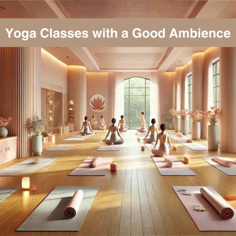 A serene yoga studio at The Pink Lotus Academia featuring soft natural lighting, spacious wooden floors, neatly arranged yoga mats, and an atmosphere enhanced by subtle aromatherapy. The room has calming pastel-colored walls, large windows allowing gentle sunlight, and a few plants adding a touch of nature. Practitioners are engaged in various yoga poses, exuding peace and focus, creating a tranquil and inviting ambience perfect for a holistic yoga experience.