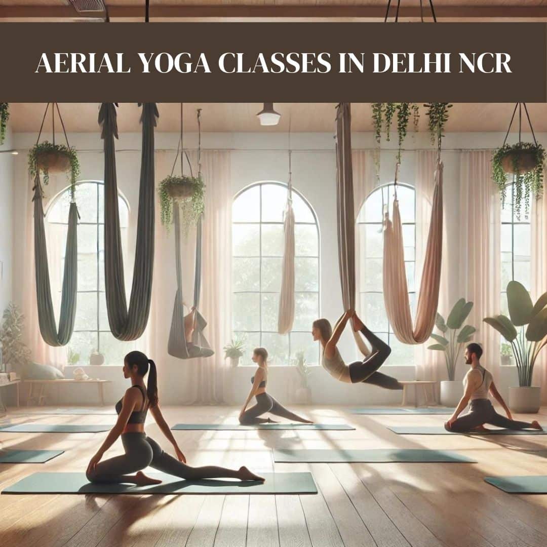 Participants practicing aerial yoga in a serene studio, suspended in hammocks. The room features soft natural light, pastel tones, wooden floors, and lush green plants, creating a calm and holistic atmosphere. The individuals are focused and relaxed, embodying strength and mindfulness.