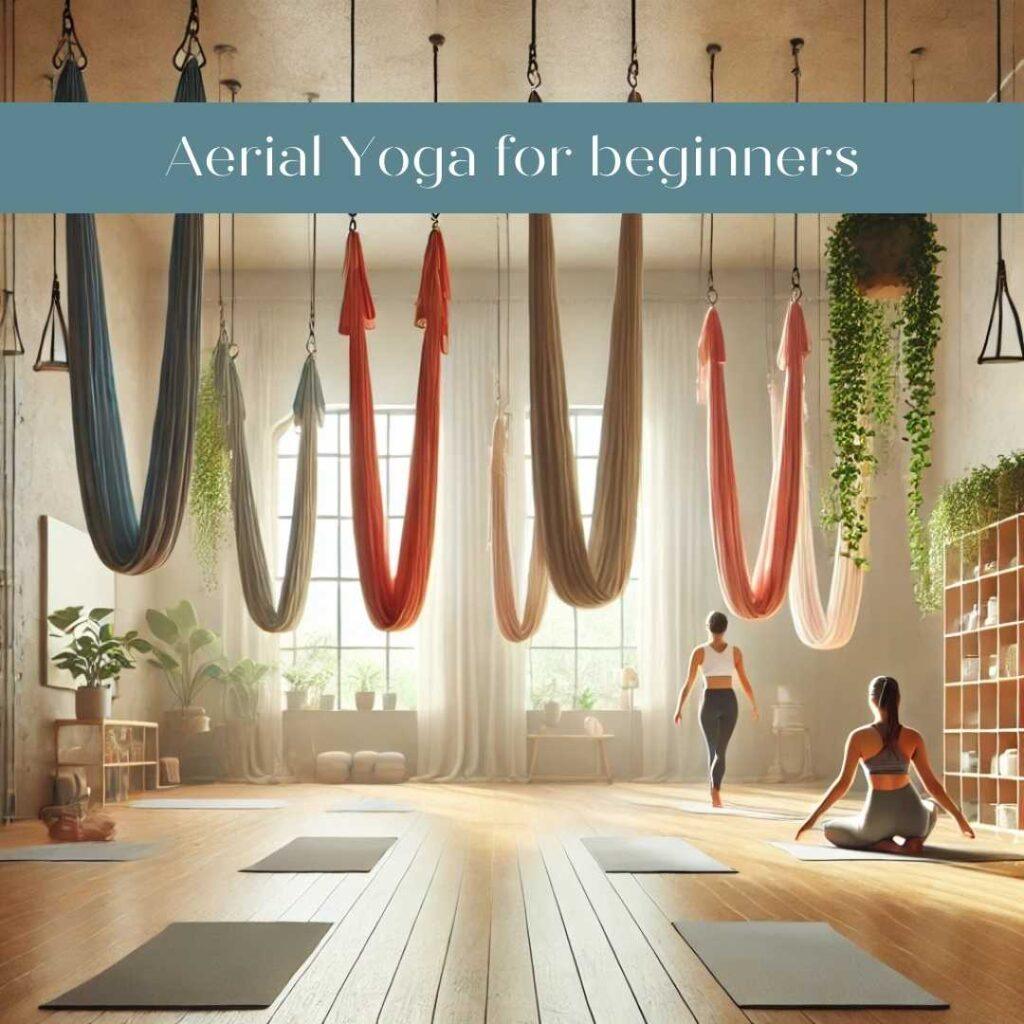 A peaceful aerial yoga studio with colorful hammocks hanging from the ceiling, softly lit by natural light. Several people are practicing basic aerial yoga poses like the 'inverted butterfly' and 'aerial star' in a calm, minimalist space with yoga mats and serene greenery. The overall atmosphere is relaxing and welcoming, perfect for beginners.